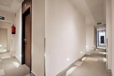 a hallway with a door in a building at Hostal Benidorm in Barcelona