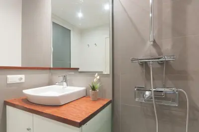 a bathroom with a sink and a shower at Sarriá - Sant Gervasi in Barcelona