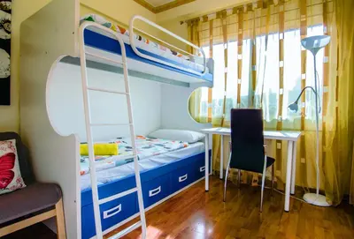 a bedroom with a bunk bed and a desk at Unique Cozy Scenic Penthouse in Barcelona