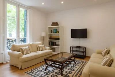 a living room with a couch and a coffee table at Habitat Apartments Bruc Terrace in Barcelona