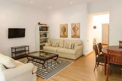 a living room with a couch and a table at Habitat Apartments Bruc Terrace in Barcelona