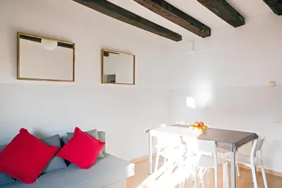a living room with a couch and a table at My Address in Barcelona Downtown in Barcelona