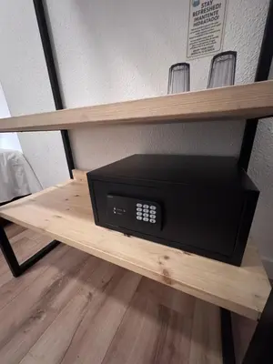 a microwave sitting on a shelf in a room at Calma House Barcelona in Barcelona