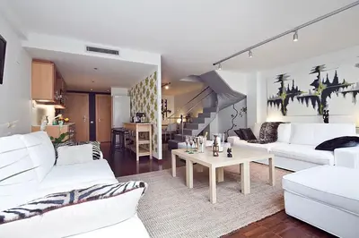 a living room with two white couches and a table at Apartment Barcelona Rentals - Private Pool and Garden Center in Barcelona