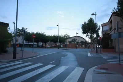 an empty street with a crosswalk in a city at Ca la Paula in Pla del Panadés