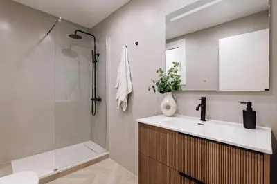 a bathroom with a sink and a shower at Lunalux Apartment in Barcelona