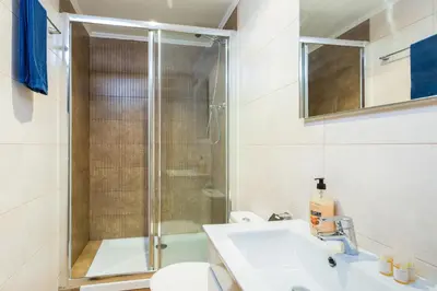 a bathroom with a shower and a sink and a toilet at The Family Host - Lost Garden Ciutadella Park in Barcelona
