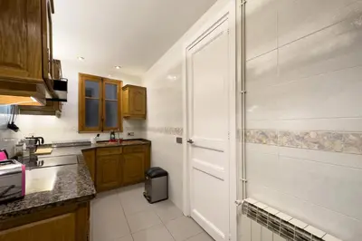 a kitchen with a shower and a white door at ApartEasy - Passeig de Gracia in Barcelona