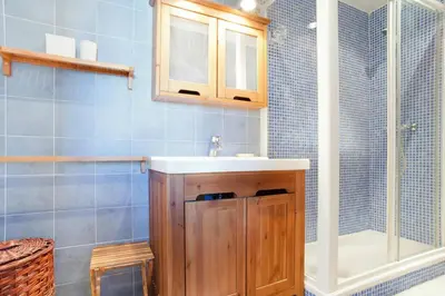 a bathroom with a sink and a shower at ApartEasy - Atic Sagrada Familia in Barcelona