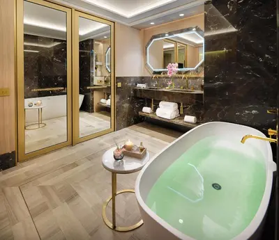 a bathroom with a large tub and a sink at The One Barcelona GL in Barcelona