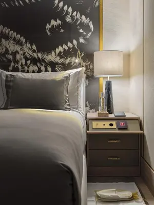 a bedroom with a bed and a table with a lamp at The One Barcelona GL in Barcelona