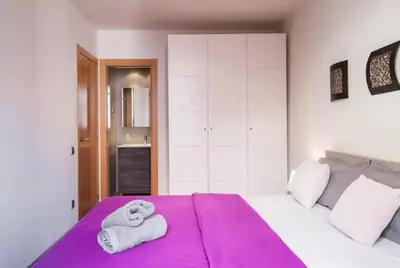 a bedroom with two towels on a bed at Tendency Plaza España in Barcelona