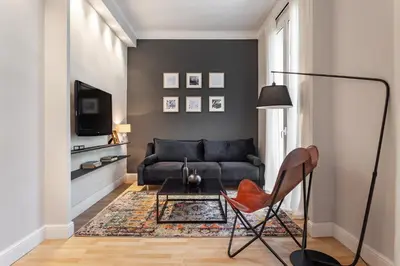 a living room with a couch and a chair at Sagrada Familia V in Barcelona