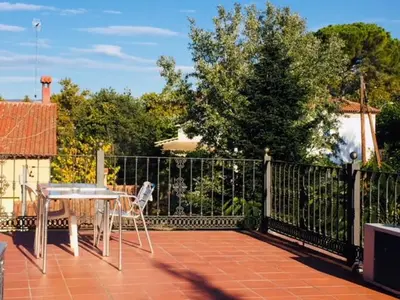 a balcony with a table and a fence at Hostal del Carmen in Terrassa