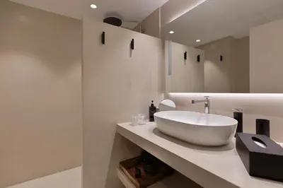 a bathroom with a large white sink on a counter at RAMBLA POBLENOU Luxury in Barcelona