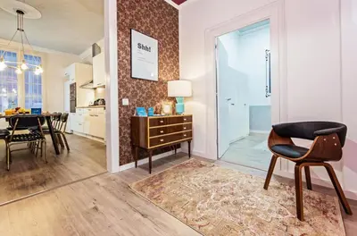 a living room with a table and a chair at Sweett - La Pedrera - Paseo de Gracia in Barcelona