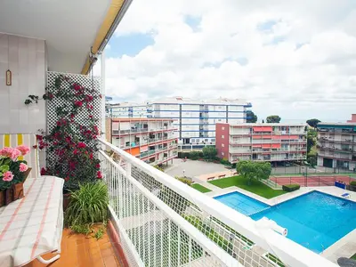 a balcony with a view of a pool and buildings at Apartment Mariola by Interhome in Sant Andreu de Llavaneres