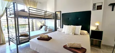 a bedroom with a bed and a bunk bed at Casa con piscina en costa Barcelona in Sant Vicenç de Montalt