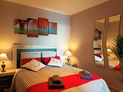 a bedroom with a bed with two towels on it at Marina Port & Beach-Apartment in Masnou