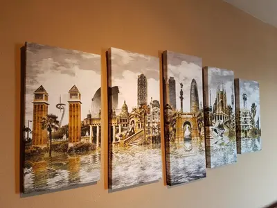 a group of four paintings hanging on a wall at Marina Port & Beach-Apartment in Masnou