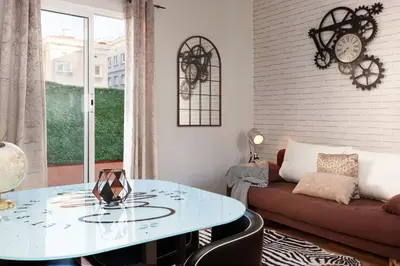 a living room with a glass table and a couch at Penthouse in Sagrada Familia in Barcelona