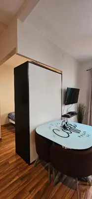 a room with a table with a computer on it at Penthouse in Sagrada Familia in Barcelona