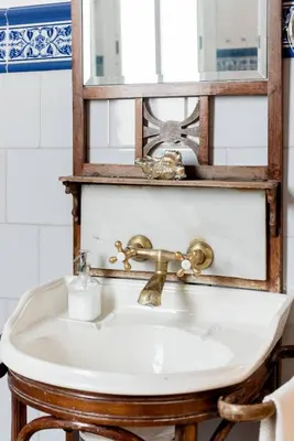 a bathroom sink with a mirror above it at Lovely loft near Barcelona center in Barcelona