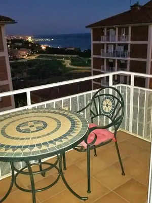 a table and chairs on a balcony with a view of the ocean at Helena Seaview & Beach-apartment in Montgat