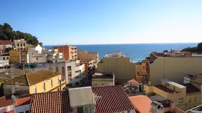a city with buildings and the ocean in the background at Claire Seaview & Beach-apartment in Montgat