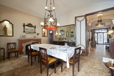 a dining room with a table and chairs at CAL PADRI1871 - 30min to Barcelona, Groups & Families, Beach Stylish House in Premiá de Mar