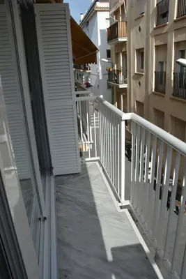 a balcony of a house with a white railing at Apartamento Flavia II Sant Damià in Sitges