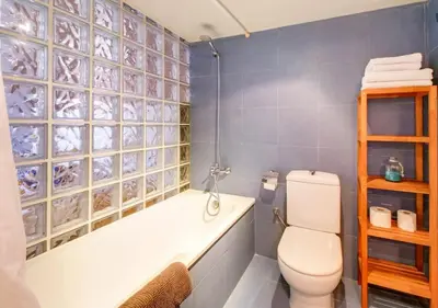 a bathroom with a toilet and a tub and a sink at Camp Nou Apartment in Hospitalet de Llobregat