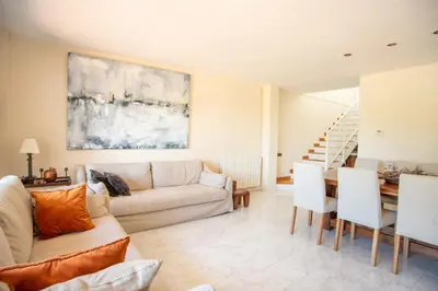 a living room with a couch and a table at Casa Cala Balmins in Sitges