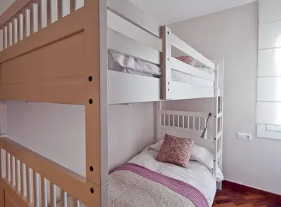 a small bedroom with a bunk bed and a bunk bed at Ciutadella Park Born in Barcelona