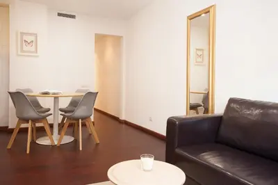 a living room with a couch and a table at Click&Flat Europa Fira Apartments in Hospitalet de Llobregat