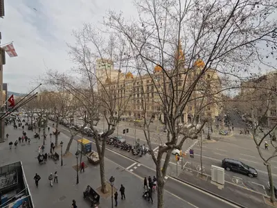 a view of a city street with people and a building at Paseo de Gracia Design in Barcelona