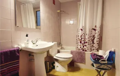 a bathroom with a sink and a toilet and a shower at Gorgeous Apartment In Pineda De Mar in Pineda de Mar