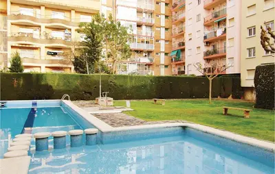 a swimming pool in the middle of a building at Gorgeous Apartment In Pineda De Mar in Pineda de Mar