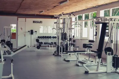 a gym with several treadmills and exercise machines at Camping Sènia Caballo de Mar in Pineda de Mar