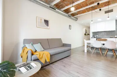 a living room with a couch and a table at Modern Catalan Apartments by Olala Homes in Hospitalet de Llobregat