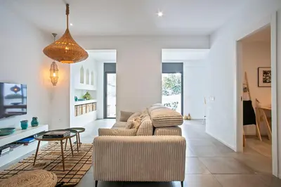 a living room with a couch and a table at Destino Sitges in Sitges