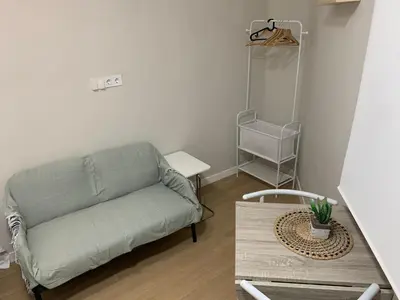 a living room with a couch and a table at Plaza de España independent house in Barcelona