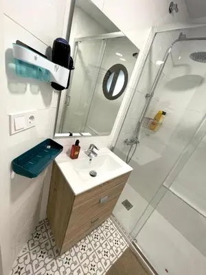 a bathroom with a sink and a shower at Plaza de España independent house in Barcelona
