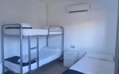 a room with two bunk beds in a room at Holidays Domus Iano in Esparreguera