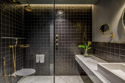 a bathroom with a shower with a sink and a toilet at Room Mate Collection Gerard, Barcelona in Barcelona