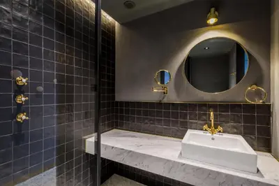 a bathroom with a sink and a mirror at Room Mate Collection Gerard, Barcelona in Barcelona