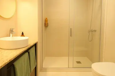 a small kitchen with a sink and a stove at Next to the sea 20' from Barcelona in Premiá de Mar