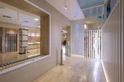 a store hallway with a window with a mannequin on the wall at GHT Maritim in Calella
