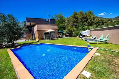 a swimming pool in the yard of a house at Catalunya Casas Modern and spacious with private pool close to BCN in Senmanat