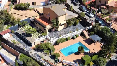 an aerial view of a house with a swimming pool at Catalunya Casas Mountain escape with amazing views just 25km to BCN! in Torrelles de Llobregat